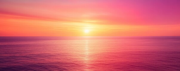 Obraz premium A breathtaking sunset over calm ocean waters, showcasing vibrant shades of pink, purple, and orange in the sky. The tranquil scene evokes feelings of peace and serenity.