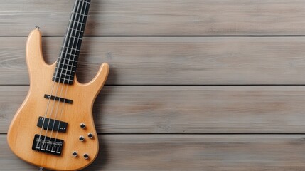 Fototapeta premium A beautifully crafted solid-body electric bass guitar in sunburst finish rests on rustic wooden backgrounds, embodying elegance and artistry