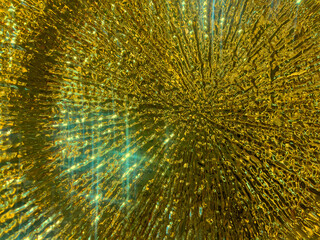 A close-up of a textured gold plate with shimmering highlights, capturing the essence of festive...