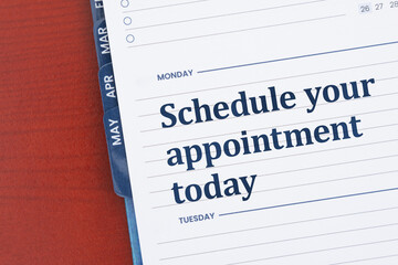 Schedule your appointment today on day planner on desk