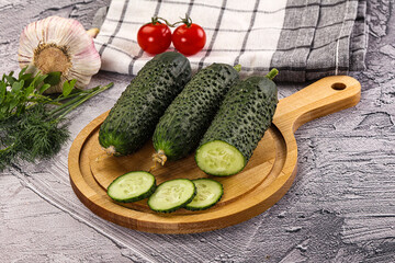 Raw green cucumbers with slices