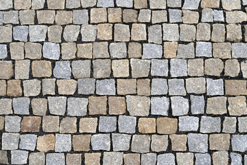 Granite cobblestone pavement background, stone textured pattern
