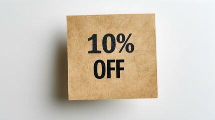 Black '10% OFF' Text on a Dark Brown Square Paper Note. White Background with Copy Space