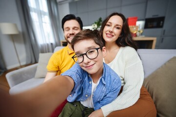 Fototapeta premium Happy family enjoying time together at home during a cozy afternoon