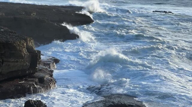 Portugal - Atlantic Ocean Waves hitting the rocky cliffs on the shores of Portugal