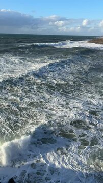 Portugal - Atlantic Ocean Waves hammering ashore on a rocky beach 