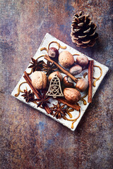 Christmas decoration on rustic stone background. Top view. Copy space.