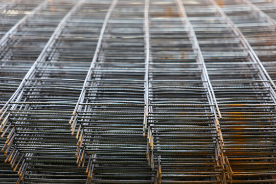 A close up of a metal mesh with many small holes - Powered by Adobe