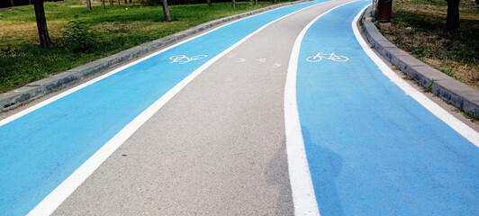 bicycle sign on a bike path in the park. empty bike path in the park. bike path