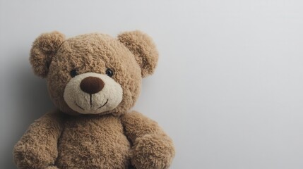 Obraz premium cute brown teddy bear plushie set against a clean white background, showcasing its soft fur and charming expression, evoking feelings of comfort and nostalgia