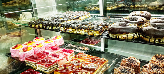 Dessert table with all kinds snacks on light background. Candy bar. Celebration concept. Top view, flat lay, panorama