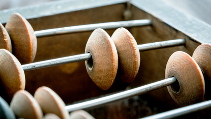 vintage abacus or abacus on wooden background