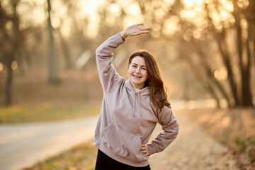 Woman Stretching In Park