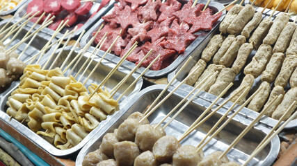 Various kinds of satay are displayed in festival night street food