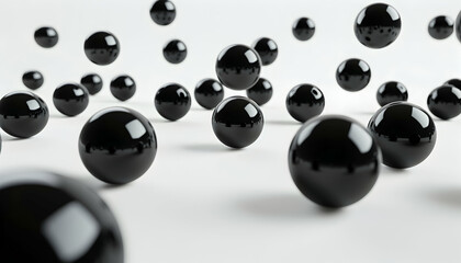 A scattering of glossy black spheres on a white background, creating a visually engaging abstract design.