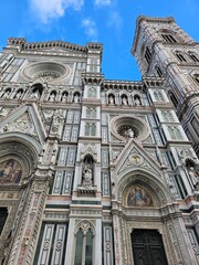 Florence, Italy - October 5, 2024: Discovering the city of Florence in autumn days. Frome the Duomo to Ponte Vecchio, old architecture covering the city. Beautiful sky reflected over Arno river.