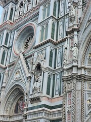 Florence, Italy - October 5, 2024: Discovering the city of Florence in autumn days. Frome the Duomo to Ponte Vecchio, old architecture covering the city. Beautiful sky reflected over Arno river.