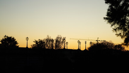 The beautiful sunset city view with the silhouette of the monument tower in Washington DC
