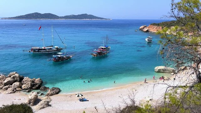 Soguk Su Koyu, Cold Water Bay, is a beach in Turkey located in the Fethiye district of Mugla Province. It is surrounded by mountains, vegetation, and has blue water. The beach is lined with yachts.4К