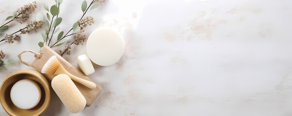 A serene flat lay of spa essentials and white flowers on a white wooden surface.