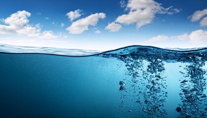 shot under clear blue water bubbles and sky. deep sea