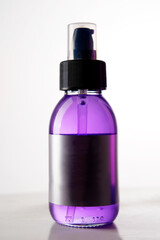 plastic container with sprayer for violet hair cosmetics