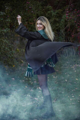Wizard school, student in the magical autumn atmosphere, green and silver colors . Halloween time,...
