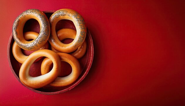 Bagels on a red background top view