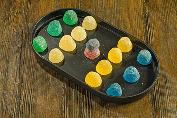 Assorted Jelly Candies on Wooden Background