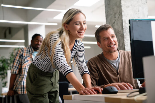 Diverse business colleagues gather in boardroom brainstorm discuss financial statistics together