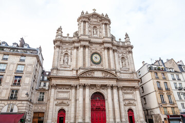 Obraz premium Eglise Saint Paul Saint Louis in Paris is a stunning example of Baroque architecture. Cathedral Facade intricate stonework, paired with elegant sculptures