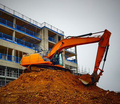 Large Orange Excavator on Construction Site