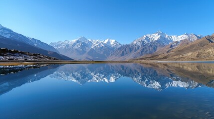 A serene mountain lake reflecting snow-capped peaks under a clear blue sky, Alpine setting with pristine nature, Tranquil style