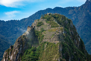 Machu Picchu is a 15th-century Inca citadel located in the Andes Mountains of Peru, near the city of Cusco. It was built around 1450 during the reign of the Inca emperor Pachacuti.