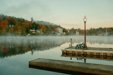 Morning fog and autumn color on Saranac Lake in the Adirondack Mountains, New York