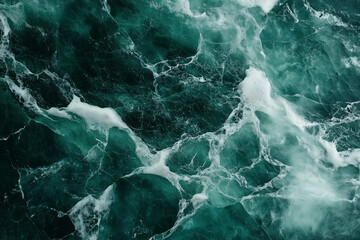 Abstract emerald green ocean waves with white foam