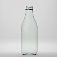 Clear empty glass bottle on white background
