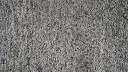 Close-up of rough gray concrete texture. Detailed stone-like surface, ideal for backgrounds, industrial themes, or raw material design elements
