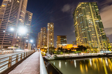 Fototapeta premium Modern city buildings along the Pasig River, at night in the Makati District,Manila,The Philippines.