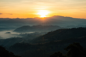 Obraz premium Mountain landscape, nature calm. Sunrise and there is mist in the mountains.