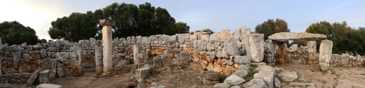 Panoramic view of the sunset in Torre d'en Galm&eacute;s talayotic settlement. The largest settlement in Menorca. Three talaiots standing on top of the hill, plus the taula. Bealearic islands