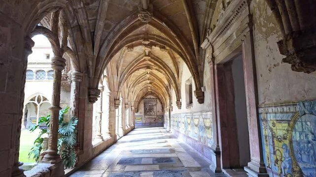 Colonnade of cloister of Santa Cruz Monastery and Church at Coimbra, Portugal. The Church of Santa Cruz is one of the most fascinating religious buildings of Coimbra in Portugal.