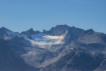 View of icebergs and mountains in the fjords of south Greenland