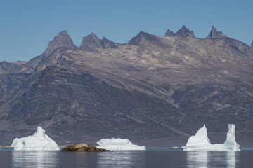 View of icebergs and mountains in the fjords of south Greenland