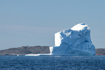 View of icebergs and mountains in the fjords of south Greenland