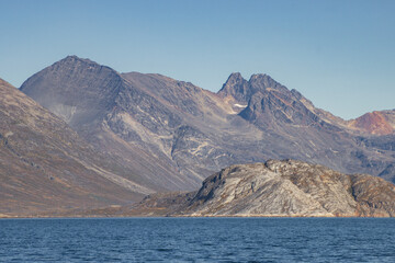 View of icebergs and mountains in the fjords of south Greenland