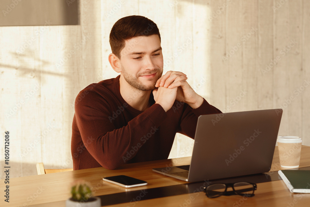 Aufkleber smiling man at laptop looking at computer screen working sitting in modern office. selective focus