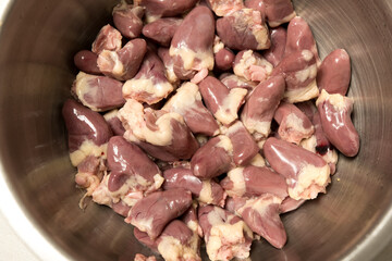 Raw chicken hearts prepared for culinary use. Essential ingredient for hearty meals and traditional recipes.