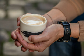 holding a coffee mug with love