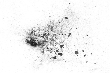 Particles of black charcoal on a white background, top view. Activated charcoal powder for facial mask.